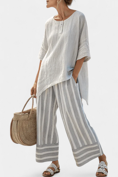 Daisy Complete with Asymmetric Blouse and Striped Trousers for a Modern and Elegant Style