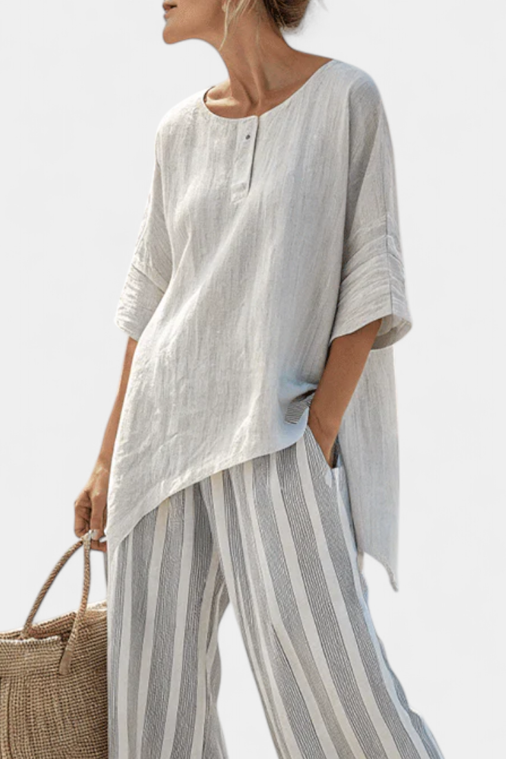 Daisy Complete with Asymmetric Blouse and Striped Trousers for a Modern and Elegant Style