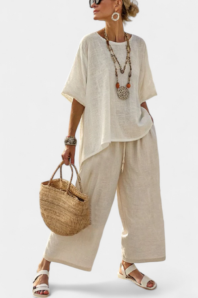 Complete Minimalist Daisy in raw tones with oversized blouse and wide trousers for a simple and elegant style